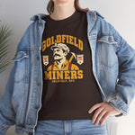 Goldfield Miners Heavyweight T-Shirt in dark chocolate with the Goldfield Miners logo, a mustached miner with a candle on his cap and a pickaxe on his shoulder on the front, worn by model