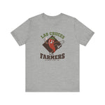 Las Cruces Farmers Premium Lightweight T-Shirt in athletic heather with the Las Cruces Farmers logo, a red chile pepper pitcher in a high-kick windup on a brown diamond, with Farmers in brown block letters on the front