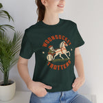 Woonsocket Trotters Premium Lightweight T-Shirt in forest with the Woonsocket Trotters logo, a harness racing driver in a baseball cap behind a trotting horse, the sulky wheel drawn as a baseball on the front, worn by model