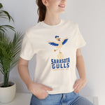 Sarasota Gulls Premium Lightweight T-Shirt in natural with the cream cartoon gull balancing on a baseball with wings spread on the front, worn by model