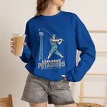 Carlsbad Potashers Crewneck Sweatshirt in royal with the Carlsbad Potashers logo, a miner in a hard hat and headlamp finishing his swing as the ball arcs over a ballpark light tower, with Potashers in block letters on the front, worn by model