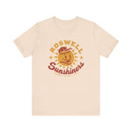 Roswell Sunshiners Premium Lightweight T-Shirt in soft cream with the Roswell Sunshiners logo, a smiling baseball sun in a red cap, with Sunshiners in red script on the front