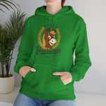 Ocala Yearlings Hoodie in irish green with the horse head peeking through a gold horseshoe wearing a green cap on the front, worn by model