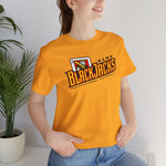 Reno BlackJacks Premium Lightweight T-Shirt in gold with the Reno BlackJacks logo, a Jack of Spades holding a bat above slanted BlackJacks lettering on the front, worn by model