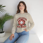 Lancaster Red Roses Crewneck Sweatshirt in sand with the Lancaster Red Roses logo, a red rose with a baseball at its center on the front, worn by model