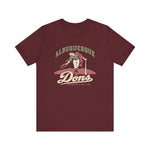 Albuquerque Dons Premium Lightweight T-Shirt in maroon with the Albuquerque Dons logo, a caped ballplayer bowing with his hat swept off in front of pink mountains, with Dons in cream script on the front