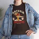 Artesia Numexers Heavyweight T-Shirt in dark chocolate with the Artesia Numexers logo, a roadrunner in a red A cap between Longhorn League and 1954 Champions banners, with Numexers in red block letters on the front, worn by model