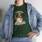 Tucson Lizards Heavyweight T-Shirt in forest green with the Tucson Lizards logo, a striped lizard in a ball cap lounging on a baseball on the front, worn by model