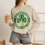 Roseburg Shamrocks Crewneck Sweatshirt in sand with the Roseburg Shamrocks logo, a shamrock of baseballs with a bat stem in a green ring on the front, worn by model