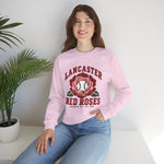 Lancaster Red Roses Crewneck Sweatshirt in light pink with the Lancaster Red Roses logo, a red rose with a baseball at its center on the front, worn by model