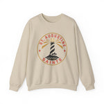 St. Augustine Saints Crewneck Sweatshirt in sand with the black and white striped lighthouse emblem with gold rays on the front