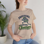 Providence Clamdiggers Premium Lightweight T-Shirt in tan with the Providence Clamdiggers logo, a quahog clam character in a green cap raking a Narragansett Bay mudflat, with Clamdiggers in green script on the front, worn by model