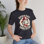 Spokane Smoke Eaters Premium Lightweight T-Shirt in dark grey with the Spokane Smoke Eaters logo, a Dalmatian in a red fire helmet and bandana blowing smoke on the front, worn by model