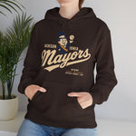 Jackson - Ionia Mayors Hoodie in dark chocolate with the top hatted mayor character in a navy suit tossing a baseball on the front, worn by model