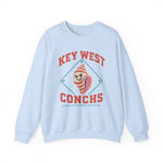 Key West Conchs Crewneck Sweatshirt in light blue with the grinning striped conch shell mascot inside a teal diamond outline on the front