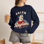 Salem Raglans Crewneck Sweatshirt in navy with the Salem Raglans logo, a mustached ballplayer in a raglan shirt on the front, worn by model