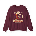 Everett Smokestackers Crewneck Sweatshirt in maroon with the Everett Smokestackers logo, a cartoon smokestack swinging a bat with a trail of smoke on the front