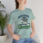 Providence Clamdiggers Premium Lightweight T-Shirt in dusty blue with the Providence Clamdiggers logo, a quahog clam character in a green cap raking a Narragansett Bay mudflat, with Clamdiggers in green script on the front, worn by model