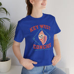 Key West Conchs Premium Lightweight T-Shirt in true royal with the grinning striped conch shell mascot inside a teal diamond outline on the front, worn by model