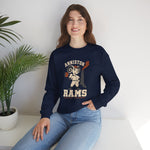 Anniston Rams Crewneck Sweatshirt in navy with the Anniston Rams logo, a cartoon ram ballplayer holding a foundry rammer beside a smoking smokestack on the front, worn by model