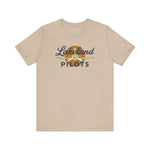 Lakeland Pilots Premium Lightweight T-Shirt in tan with the airplane propeller nose art over bold navy block lettering on the front