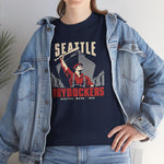 Seattle Drydockers Heavyweight T-Shirt in navy with the Seattle Drydockers logo, a shipyard worker raising a bat in front of a ship in drydock on the front, worn by model