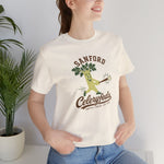Sanford Celeryfeds Premium Lightweight T-Shirt in natural with the green cartoon celery stalk mascot swinging a bat on the front, worn by model