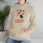 Clearwater Pelicans Hoodie in sand with the laughing pelican in a red cap swinging a bat with a ball in its beak on the front, worn by model