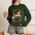 Woonsocket Trotters Crewneck Sweatshirt in forest green with the Woonsocket Trotters logo, a harness racing driver in a baseball cap behind a trotting horse, the sulky wheel drawn as a baseball on the front, worn by model
