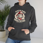 Spokane Smoke Eaters Hoodie in dark heather with the Spokane Smoke Eaters logo, a Dalmatian in a red fire helmet and bandana blowing smoke on the front, worn by model