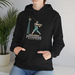 Carlsbad Potashers Hoodie in black with the Carlsbad Potashers logo, a miner in a hard hat and headlamp finishing his swing as the ball arcs over a ballpark light tower, with Potashers in block letters on the front, worn by model