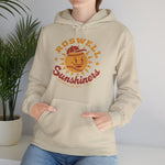 Roswell Sunshiners Hoodie in sand with the Roswell Sunshiners logo, a smiling baseball sun in a red cap, with Sunshiners in red script on the front, worn by model
