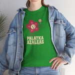 Palatka Azaleas Heavyweight T-Shirt in irish green with the smiling pink flower mascot with two baseballs above it on the front, worn by model