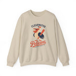 Clearwater Pelicans Crewneck Sweatshirt in sand with the laughing pelican in a red cap swinging a bat with a ball in its beak on the front
