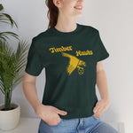 Bend Timber Hawks Premium Lightweight T-Shirt in forest with the Bend Timber Hawks logo, a diving gold hawk clutching a baseball on the front, worn by model