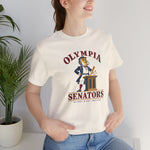 Olympia Senators Premium Lightweight T-Shirt in natural with the Olympia Senators logo, a bearded senator in a frock coat at a podium with a bat on the front, worn by model