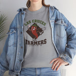 Las Cruces Farmers Heavyweight T-Shirt in sport grey with the Las Cruces Farmers logo, a red chile pepper pitcher in a high-kick windup on a brown diamond, with Farmers in brown block letters on the front, worn by model