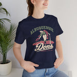 Albuquerque Dons Premium Lightweight T-Shirt in navy with the Albuquerque Dons logo, a caped ballplayer bowing with his hat swept off in front of pink mountains, with Dons in cream script on the front, worn by model