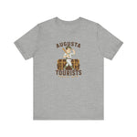 Augusta Tourists Premium Lightweight T-Shirt in athletic heather with the cartoon ballplayer with a bat standing on a travel trunk on the front