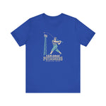 Carlsbad Potashers Premium Lightweight T-Shirt in true royal with the Carlsbad Potashers logo, a miner in a hard hat and headlamp finishing his swing as the ball arcs over a ballpark light tower, with Potashers in block letters on the front