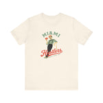 Miami Hustlers Premium Lightweight T-Shirt in natural with the mustached man in a striped vest holding playing cards and a bat on the front