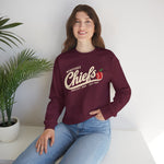 Wenatchee Chiefs Crewneck Sweatshirt in maroon with the Wenatchee Chiefs logo, script lettering with an apple stitched like a baseball on the front, worn by model