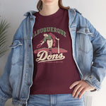 Albuquerque Dons Heavyweight T-Shirt in maroon with the Albuquerque Dons logo, a caped ballplayer bowing with his hat swept off in front of pink mountains, with Dons in cream script on the front, worn by model