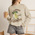 Sanford Celeryfeds Crewneck Sweatshirt in sand with the green cartoon celery stalk mascot swinging a bat on the front, worn by model