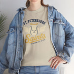 St. Petersburg Saints Heavyweight T-Shirt in sand with the cream winged baseball emblem with a halo on the front, worn by model