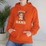 Anniston Rams Hoodie in orange with the Anniston Rams logo, a cartoon ram ballplayer holding a foundry rammer beside a smoking smokestack on the front, worn by model