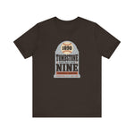 Tombstone Nine Premium Lightweight T-Shirt in brown with the Tombstone Nine logo, a grey headstone topped by a baseball marked 1890, with Base Ball Club and a Territorial Champions banner on the front