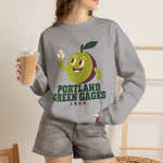 Portland Green Gages Crewneck Sweatshirt in sport grey with the Portland Green Gages logo, a cartoon green plum tossing a baseball on the front, worn by model