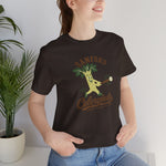 Sanford Celeryfeds Premium Lightweight T-Shirt in brown with the green cartoon celery stalk mascot swinging a bat on the front, worn by model