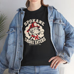 Spokane Smoke Eaters Heavyweight T-Shirt in black with the Spokane Smoke Eaters logo, a Dalmatian in a red fire helmet and bandana blowing smoke on the front, worn by model